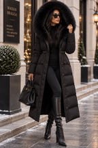 Elvara Long Puffer Coat in Black with oversized fur-trimmed hood worn up
