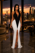 Maison Bragga Aurevia V-neck open-back evening gown with thigh-high slit in a luxury penthouse setting