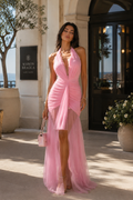 Maison Bragga Belle Rose elegant V-neck maxi dress worn in a warm luxury resort setting