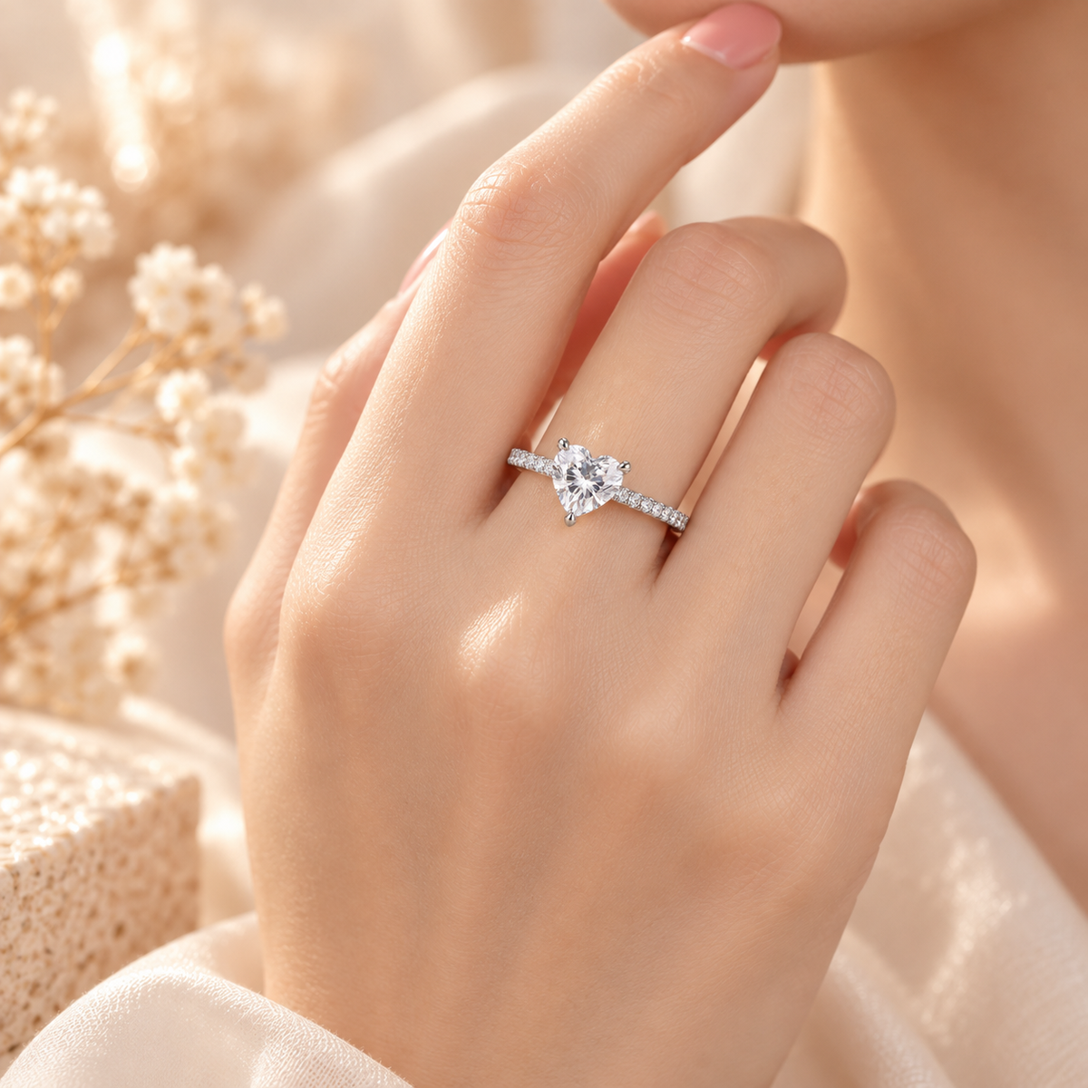 Élysée Ring worn on hand with heart-shaped lab-grown diamond and zircon pavé band
