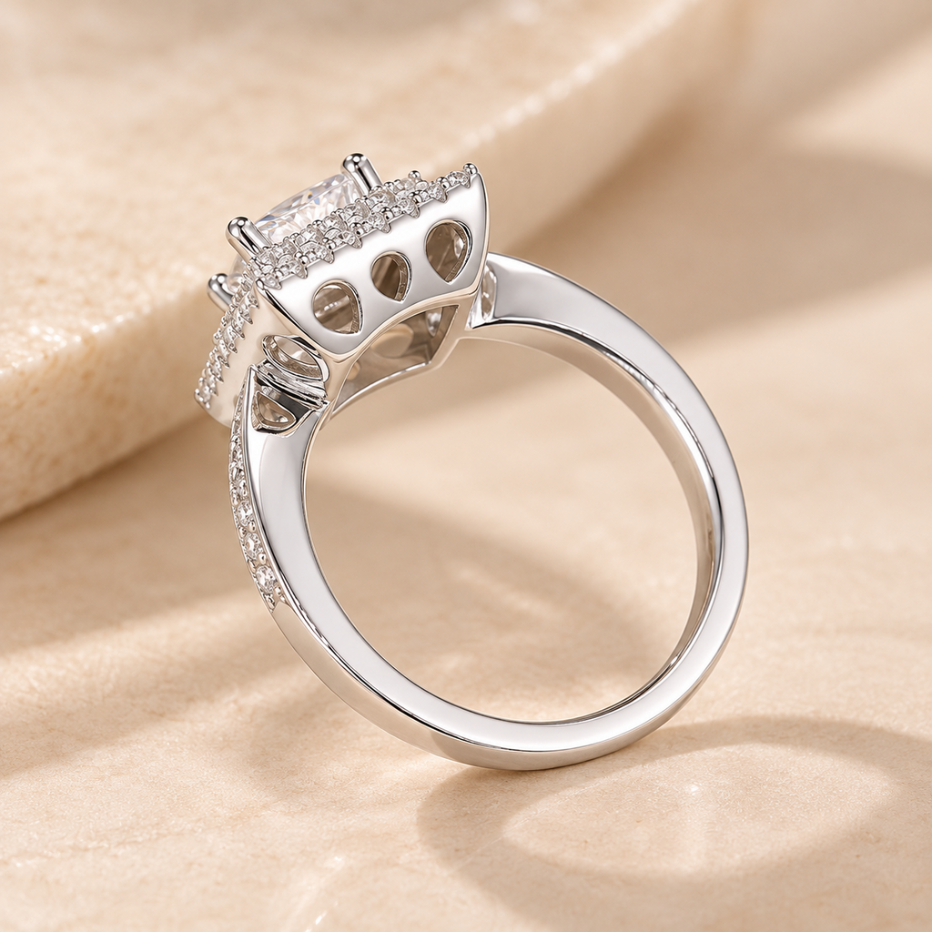 Rear profile of the Imperial Diamond Ring showing teardrop-shaped gallery cutouts beneath the princess-cut center stone