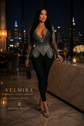 Maison Bragga Velmira black crystal-embellished sculpting jumpsuit worn in a luxury penthouse at night