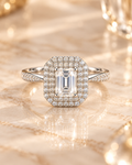 Front view of the Lumière Ring with 1 carat emerald-cut lab-grown diamond and double zircon halo