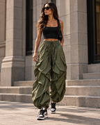 Maison Bragga Veyra sculpt parachute pants in Army Green with black crop top and sneakers
