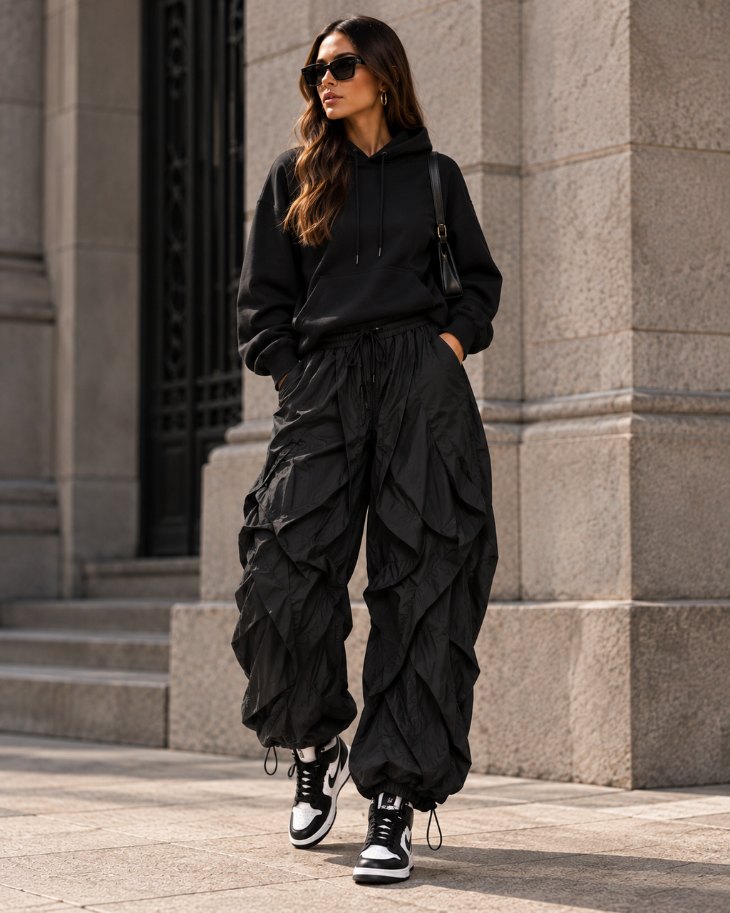 Maison Bragga Veyra parachute pants in Black styled with oversized hoodie and high-top sneakers