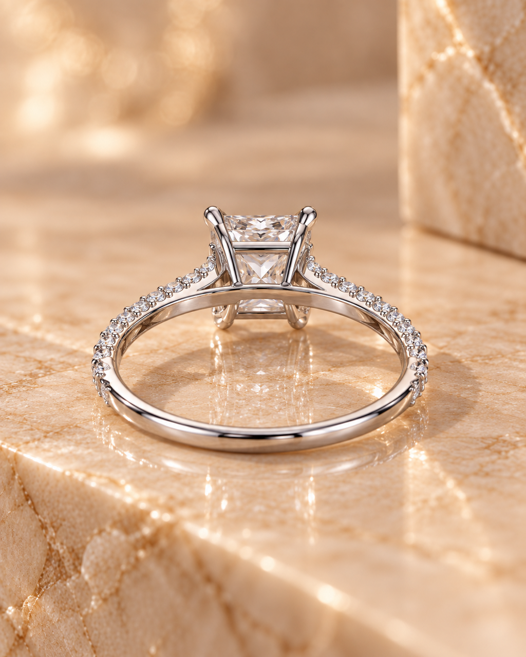Rear profile of the Ophelia Ring showing the raised four-prong gallery and pavé shoulders