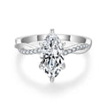 Close-up of the Sélyria marquise moissanite and twisted silver band