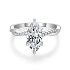 Close-up of the Sélyria marquise moissanite and twisted silver band