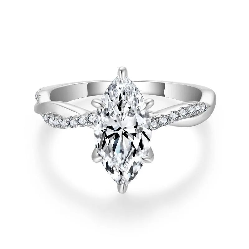 Close-up of the Sélyria marquise moissanite and twisted silver band
