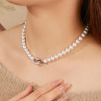Close-up of the Élysea Pearl Necklace geometric zircon pendant