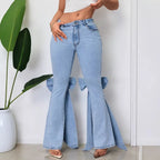 Maison Bragga Papillon blue flared denim pants styled in a refined contemporary setting