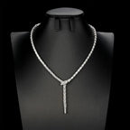 Close-up of the Selene Snake Necklace zircon inlay and fluid silhouette