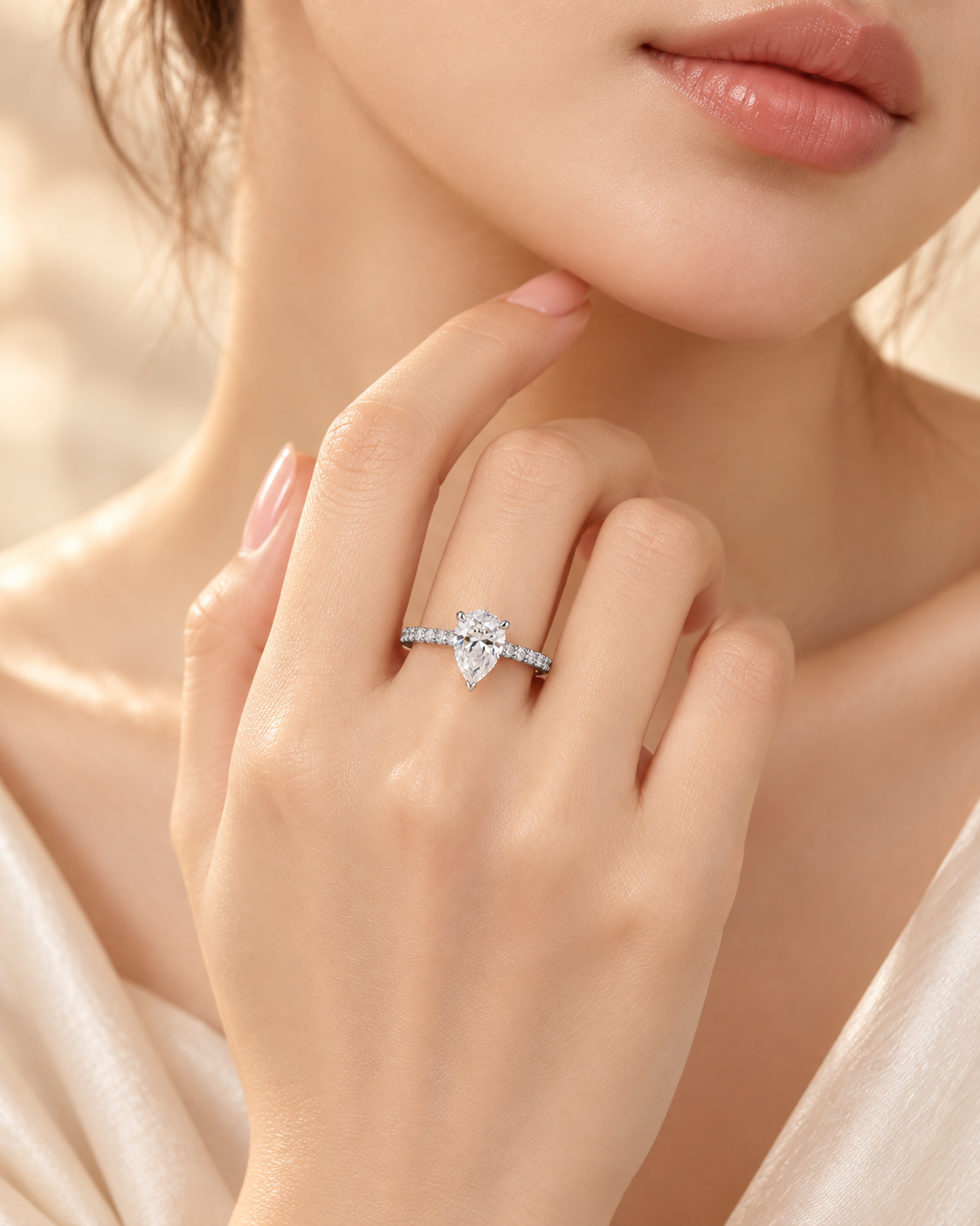 Lifestyle view of the Seraphine Diamond Ring with pear-cut center diamond and pavé shoulders