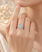 Valencia Ring worn on hand with oval lab-grown diamond and double zircon halo