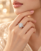 Lifestyle view of the Versailles Ring showing its pear-cut center diamond and double halo